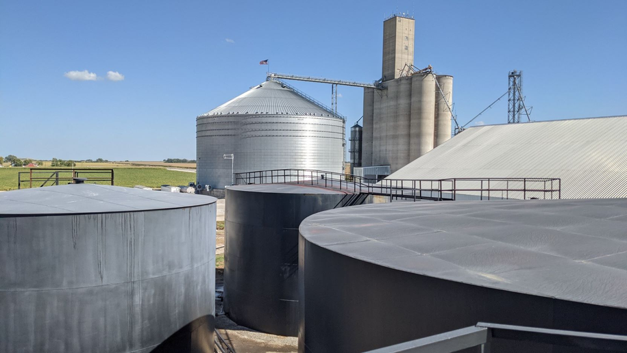 ag retailer building with grain elevator, bins, and tanks